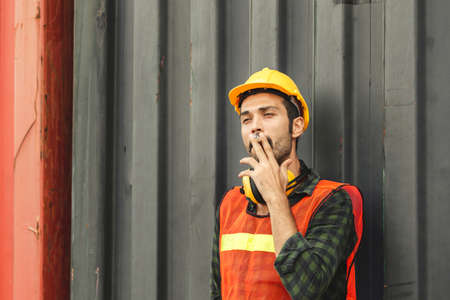 Worker with a cigarette smoke break, Labour takes a cigarette break