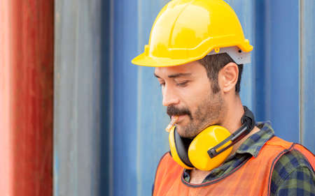 Worker with a cigarette smoke break, Labour takes a cigarette break