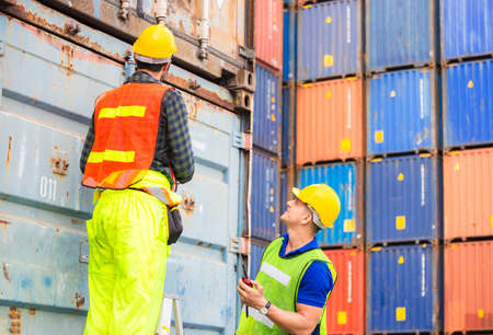 Engineer and worker team checking containers box from cargo, Happiness and Teamwork conceptの写真素材