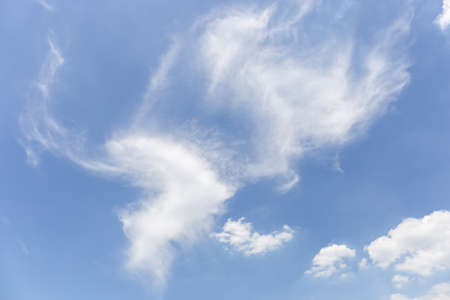 Blue sky with white clouds on a bright dayの写真素材