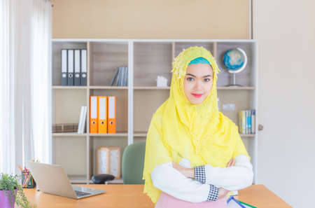Selective focus of Happiness young business arab middle eastern muslim woman in officeの写真素材