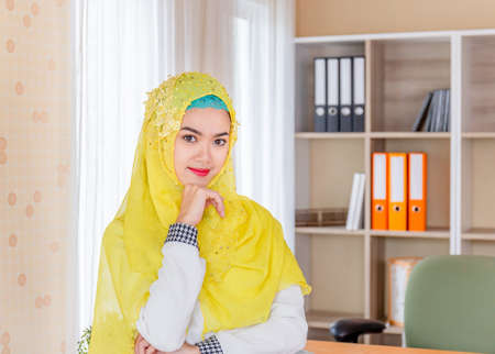 Selective focus of Happiness young business arab middle eastern muslim woman in officeの写真素材