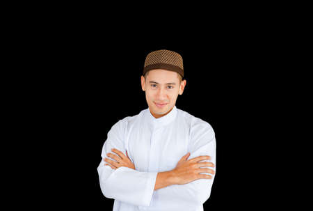 Selective focus of Happy young business arab middle eastern muslim man on black backgroundの写真素材