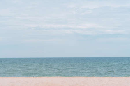 Sea view from tropical beach with sunny blue sky. Yellow sand for beautiful backgroundの写真素材