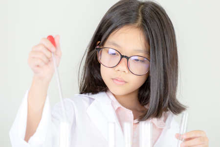 Children science concept, Portrait of teenager students educate in laboratory or classroom about chemical solutionの写真素材