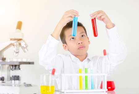 Children science concept, Portrait of teenager students educate in laboratory or classroom about chemical solutionの写真素材