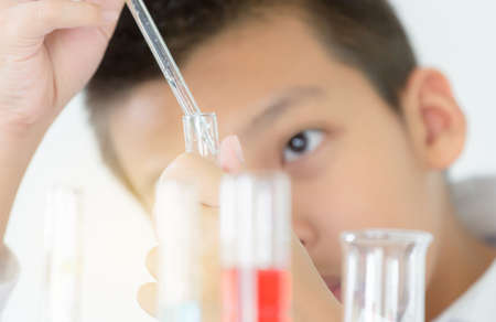 Children science concept, Portrait of teenager students educate in laboratory or classroom about chemical solutionの写真素材