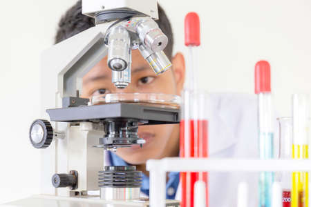 Children science concept, Portrait of teenager students educate in laboratory or classroom about chemical solutionの写真素材