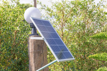 Small solar panel garden light bulb in park, Environmental Protection conceptの写真素材