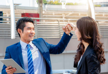 Business people partnership joining hands with city background, Success Teamwork and Partnership Conceptの写真素材