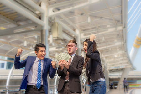 Business people team collaboration when receive good news, Successful teamwork and modern smart working conceptの写真素材