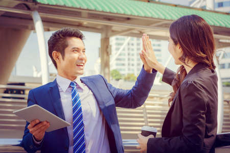 Business people partnership joining hands with city background, Success Teamwork and Partnership Conceptの写真素材