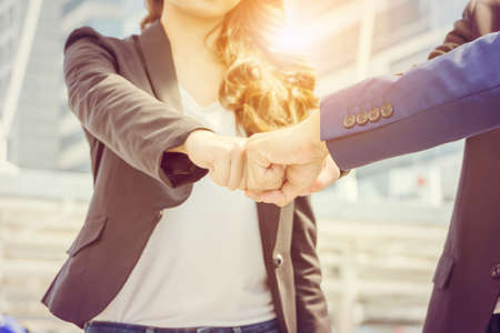 Success Teamwork Concept, Business people joining hands city backgroundの写真素材