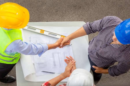 Engineer man team handshake finishing up a meeting business partnership after good job, Success and...