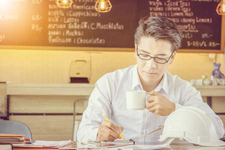 Close up of portrait engineering businessman working in coffee shop, Smart business conceptの写真素材