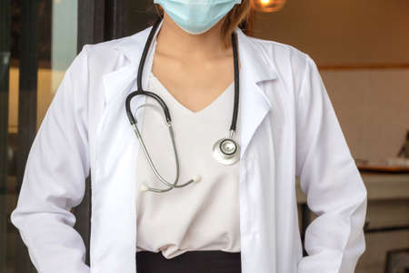 Young female doctor with stethoscope over blurred in the background, Medical and Healthcare Concepts.の写真素材