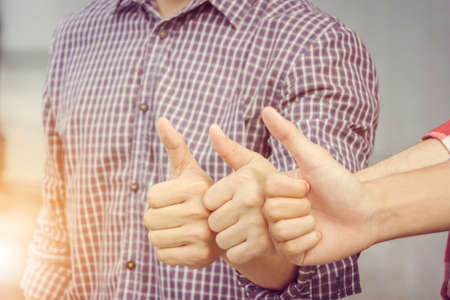 Engineer team giving thumb up as sign of Success Business Teamwork Concept