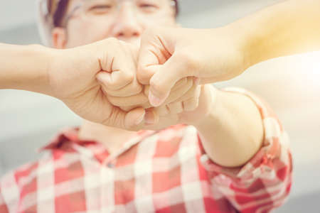 Close up of business engineer man team joining hands at construction site, Success and happiness Teamwork conceptの写真素材