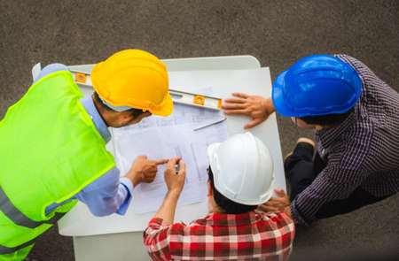 Team of Architect engineer planning group project partners meeting at building site, Construction site office teamwork conceptの写真素材