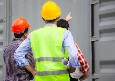 Engineer man team checking containers box from cargo container