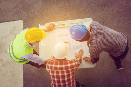 Team of Architect engineer planning group project partners meeting at building site, Construction site office teamwork conceptの写真素材