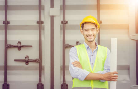 Close up of smile business engineer man with blue print in hand, construction conceptの写真素材