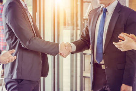 Success and happiness teamwork concept, Businessman handshake finishing up a meeting business partnership after good dealの写真素材