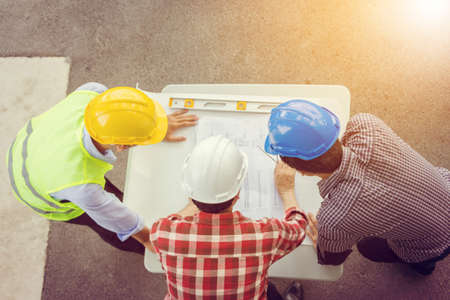 Team of Architect engineer planning group project partners meeting at building site, Construction site office teamwork conceptの写真素材