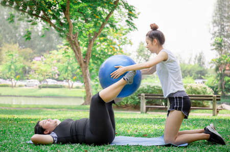Young women and friend exercising in the park, healthy and lifestyle concept