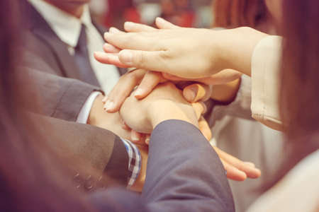 Success Teamwork Concept Business people joining hands city background.