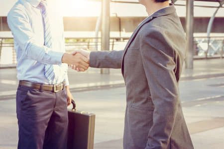 Success and Happiness concept, Business man handshake at city outside office.の写真素材