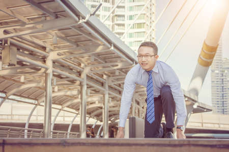 Business man in start position runner city background, Start for success concept.の写真素材