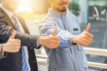 Team giving thumb up as sign of Success Business Teamwork Conceptの写真素材
