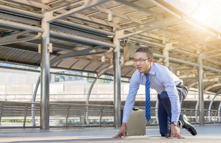 Business man in start position runner city background, Start for success concept.の写真素材
