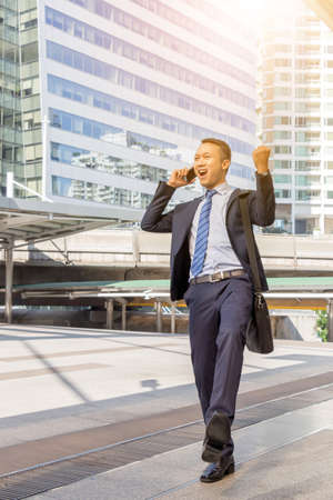 Success and Happiness concept, Business Engineer Man Celebration at city outside office.の写真素材