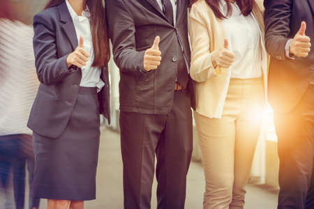 Businessman and Businesswoman Team giving thumb up as sign of Success Business Teamwork Concept.の写真素材