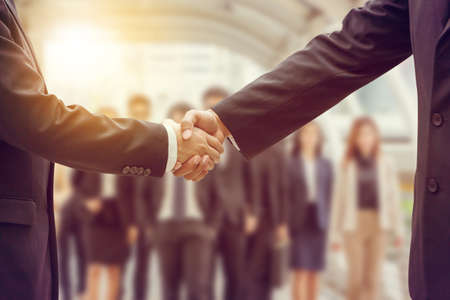 Success and Happiness Team Concept, Business man handshake at city background.の写真素材