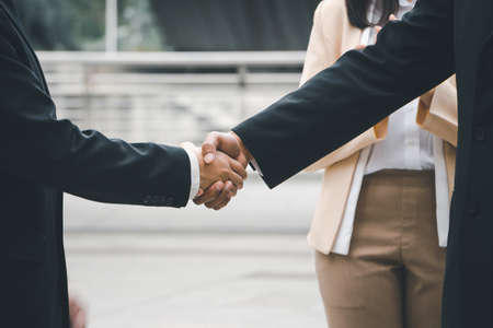 Success and Happiness Team Concept, Businessman handshake finishing up a meetingの写真素材