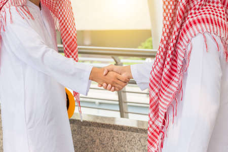 Arab middle eastern Business engineer man handshake at construction site, Success and Happiness Team Concept.の写真素材