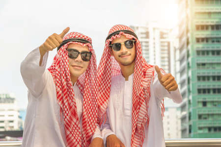 Arab Middle Eastern Businessman Team giving thumb up as sign of Success Business Teamwork Concept.
