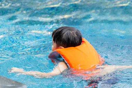 little kid boy swimming in outdoor pool, kids swimming in pool