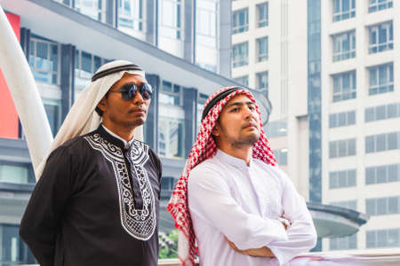 Two Arab Middle Eastern business man walking in downtownの写真素材