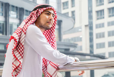 Portrait of Young Arab middle eastern man standing enjoy at outdoor city view backgroundの写真素材