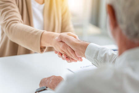 Senior man and woman handshake after meeting, Success teamwork conceptsの写真素材