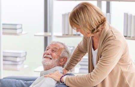 Portrait of happy senior couple in living room, Elderly man and woman relaxing on cozy sofa at home, Happy family conceptsの写真素材