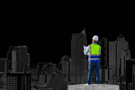 Engineer man in waistcoats and hardhats with documents looking plans for building construction...