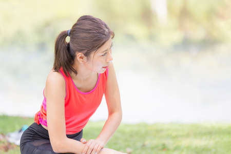 Fitness woman stretching muscles before sport activity, Young sport woman stretching and preparing...