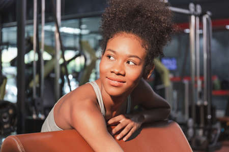 Cheerful attractive fit woman in gym, Breaking relax woman exercise workout in gym fitnessの写真素材