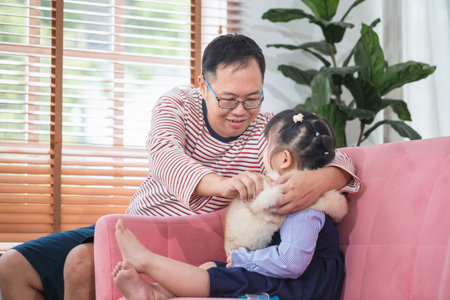Asian father and daughter playing together at home, Family conceptsの写真素材