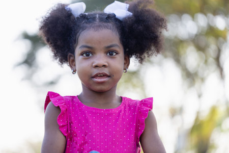 Cute little kid girl playing outdoors in the garden, Child girl in the park